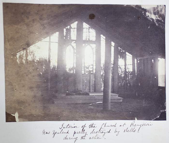 Interior of a church at Rangiriri, Waikato, c1870. Rangiriri was the key battle in the Waikato invasion. This church was partly destroyed by gunfire. Photograph by M Higginson. Album PH-ALB-510-p5
